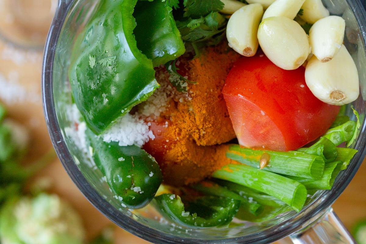 sofrito ingredients in a blender cup