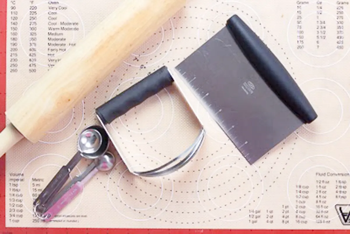 measuring tools, rolling pin, scrapers and cutters used to make great biscuits