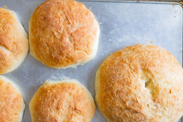 baked bread bowls on a sheet pan