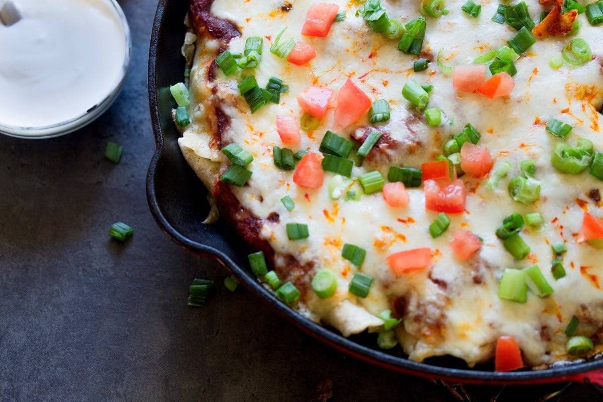 cheesy enchiladas with tomato ans scallion