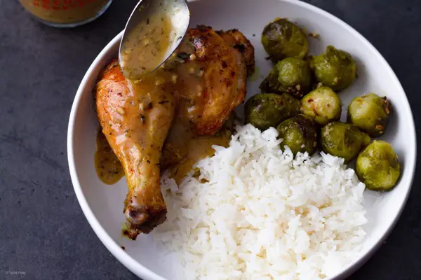 Pan Sauce spooned over lemon pepper chicken leg