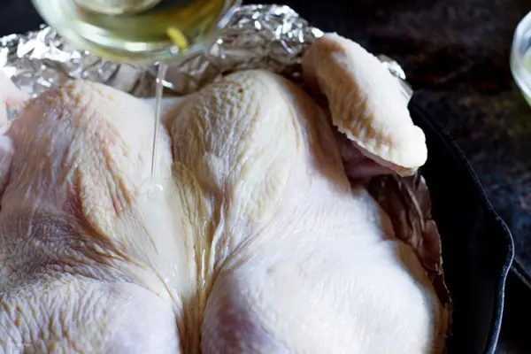 Whole chicken coated with oil