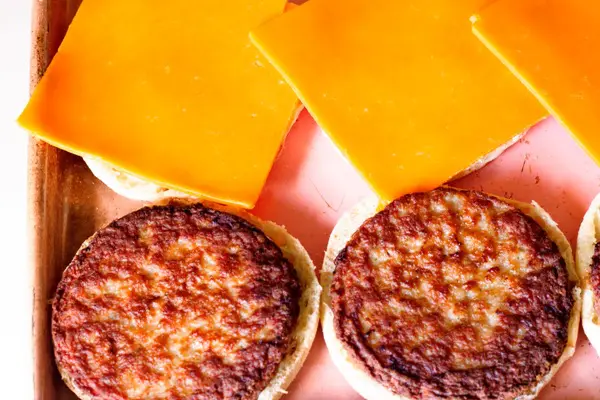 sausage and cheese on an engli