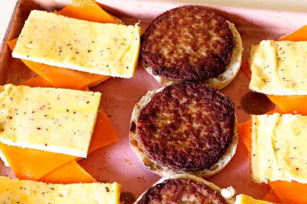 baked egg slices on english muffins with cheese
