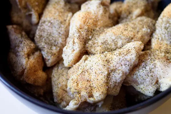 seasoned wings in a bowl