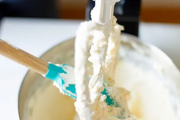 scraping cream cheese off of mixer beater