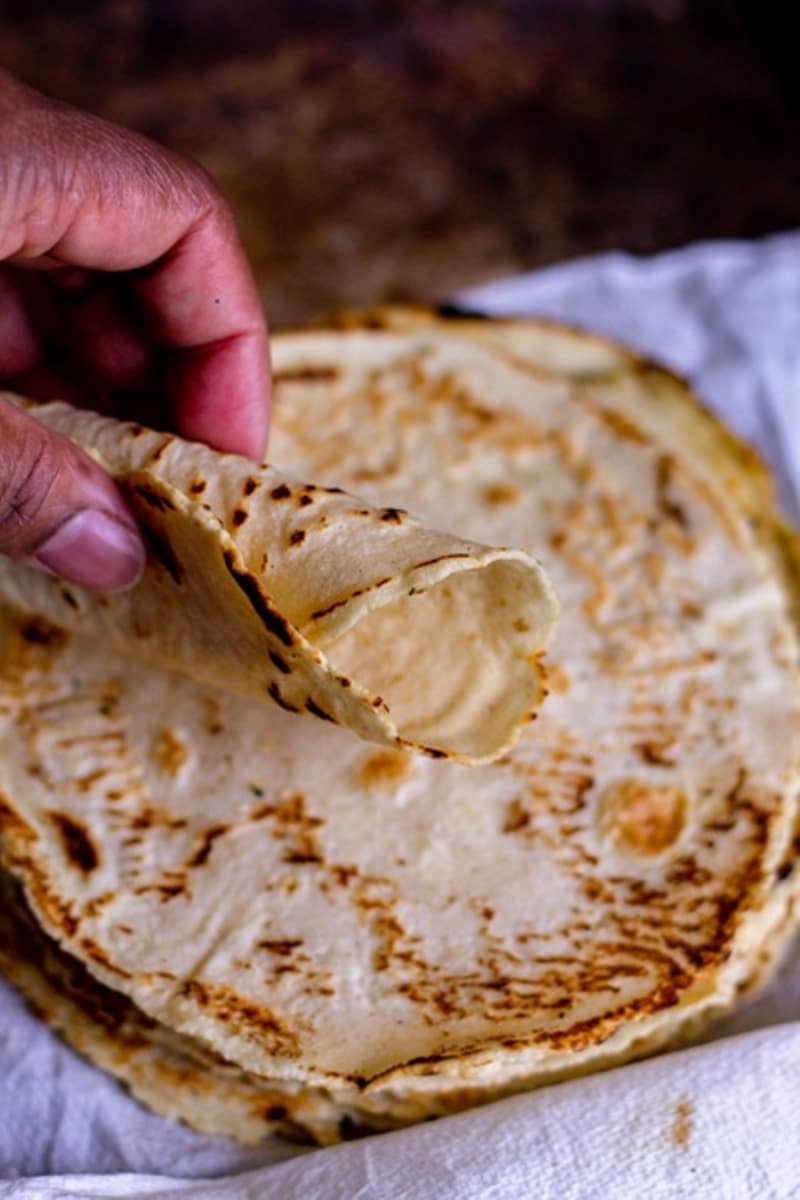 rolled hand-held corn tortilla vertical