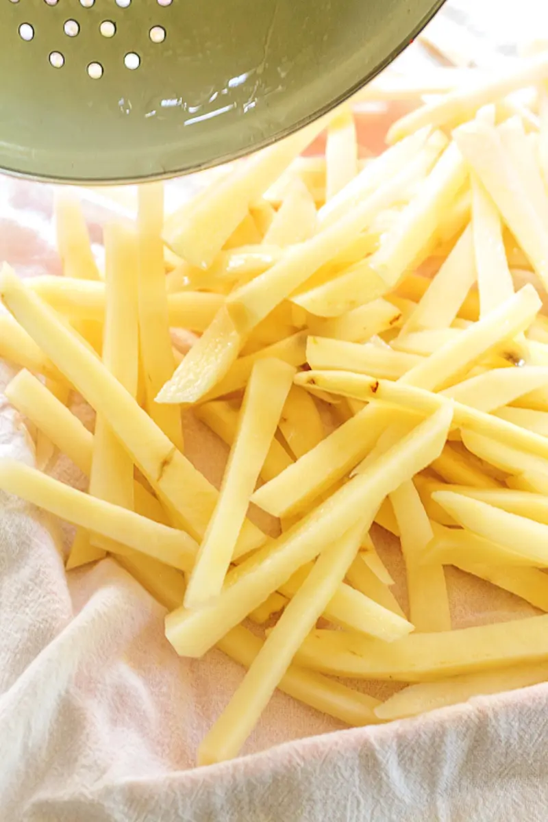 drying potatoes on a cloth towel