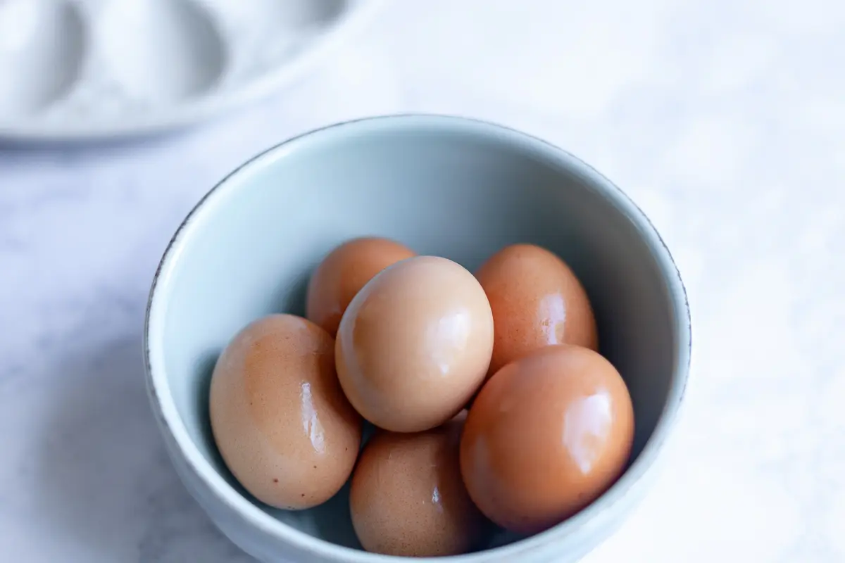 hard boiled eggs in a blue bowl