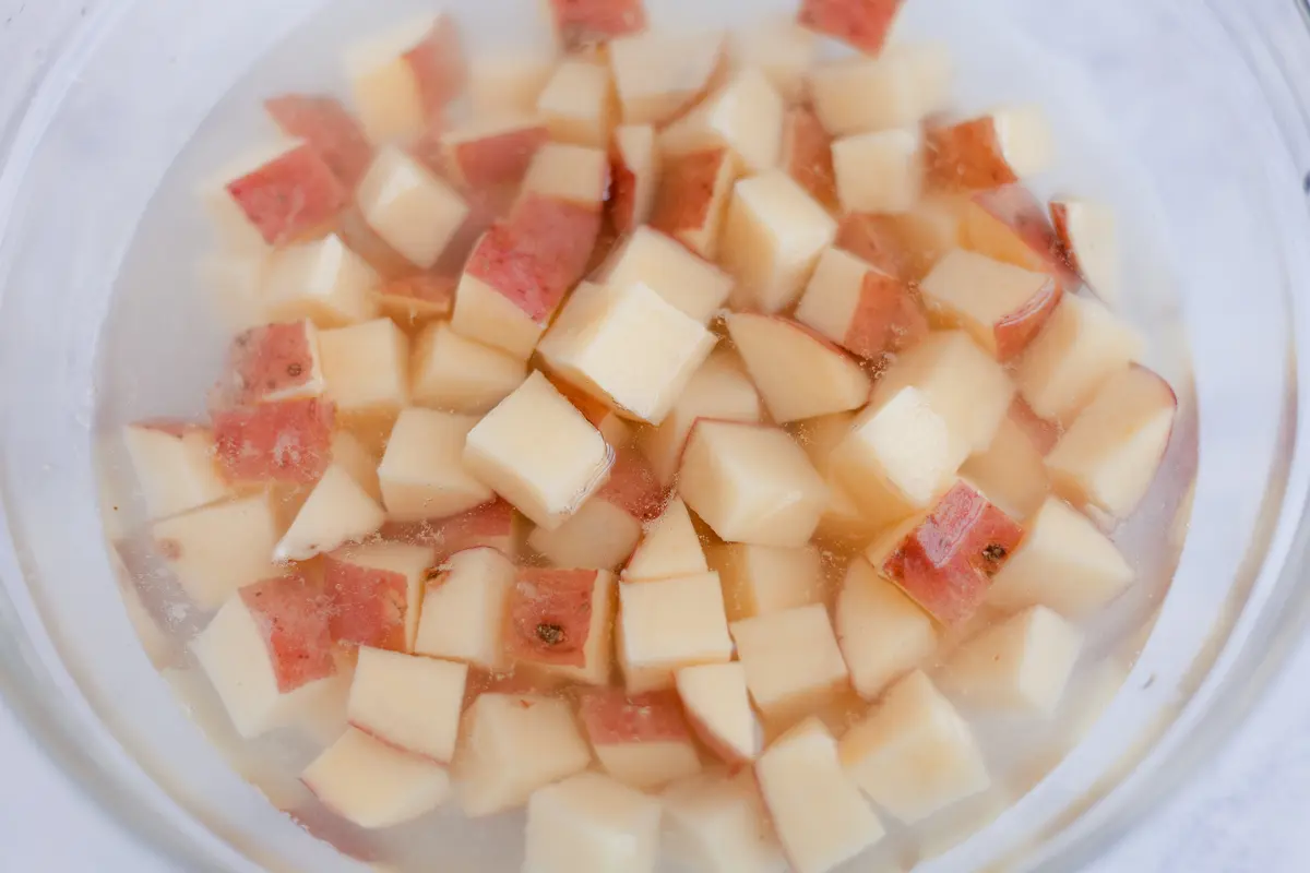 diced red potatoes in water