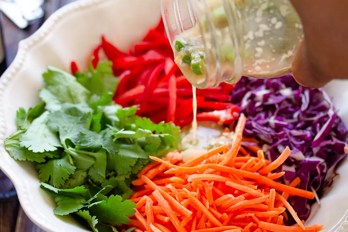 sesame ginger dressing poured over salad