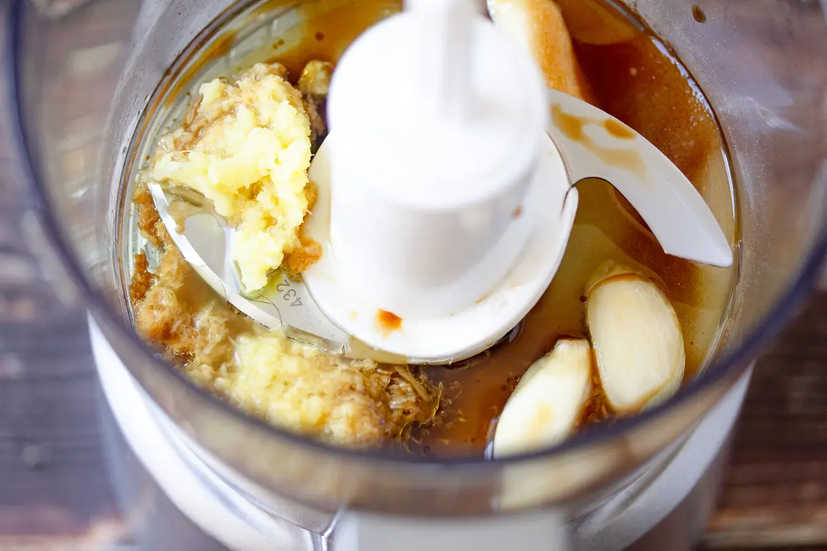 dressing ingredients in a food processor before processing