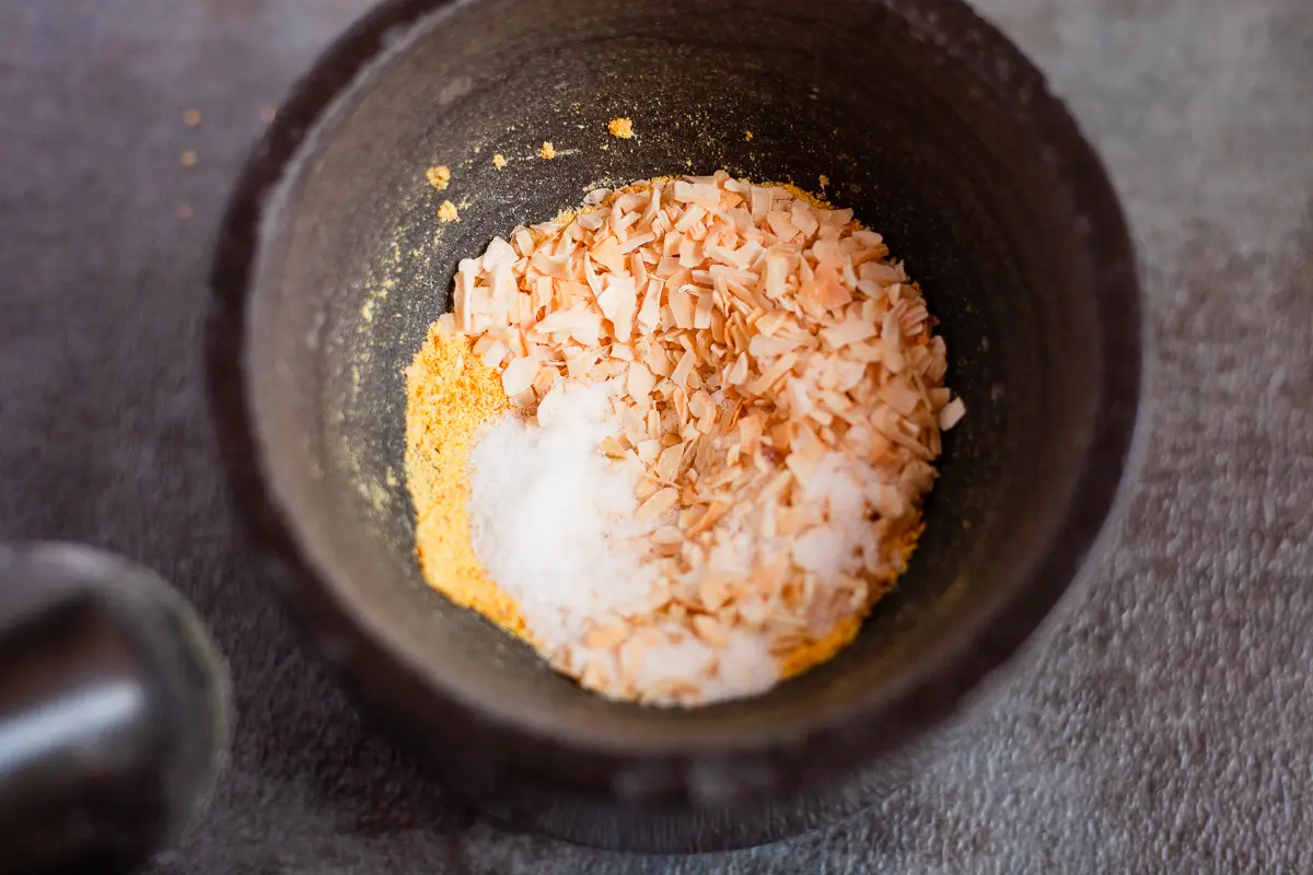 dried onion and salt in a mortar