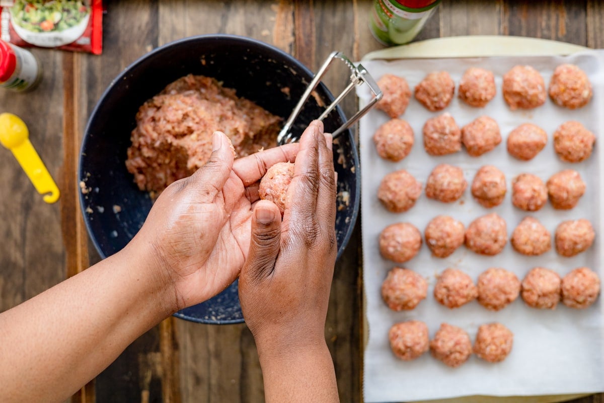 shaping the meatballs